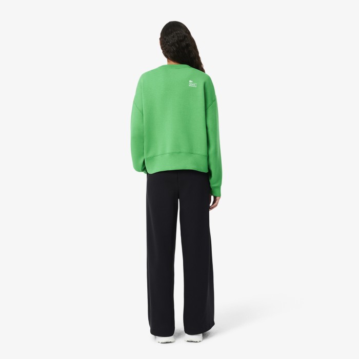 женские спортивные брюки  из хлопка от бренда lacoste вид слева