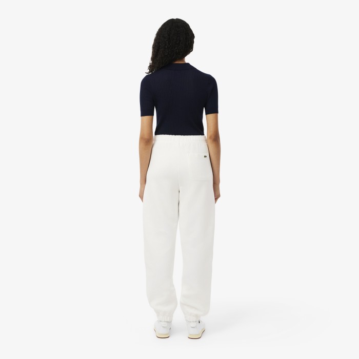 женские спортивные брюки  из органического хлопка от бренда lacoste вид слева