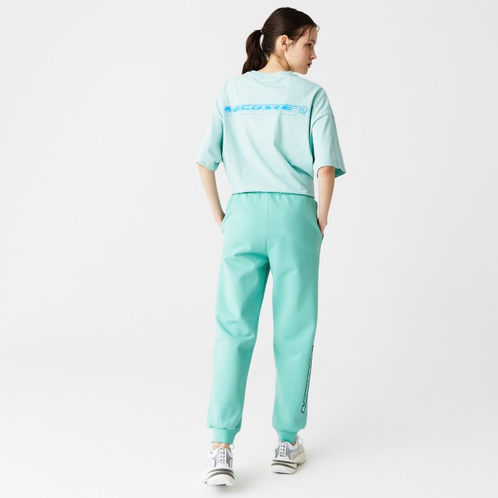 женские спортивные брюки  приталенного кроя от бренда lacoste вид слева