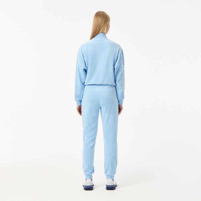 женские спортивные брюки  от бренда lacoste вид слева