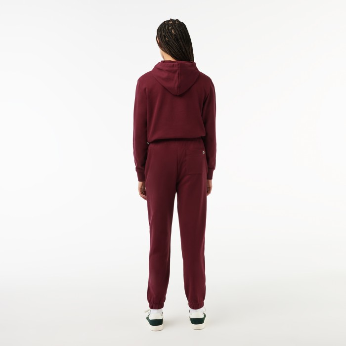 женские спортивные брюки  от бренда lacoste вид слева