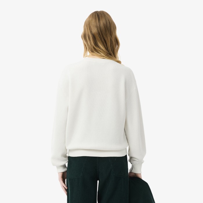 женский свитер  свободного кроя от бренда lacoste вид слева