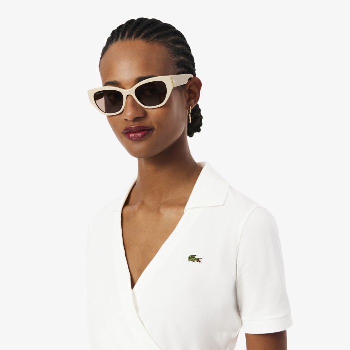 женское хлопковое поло  от бренда lacoste вид слева