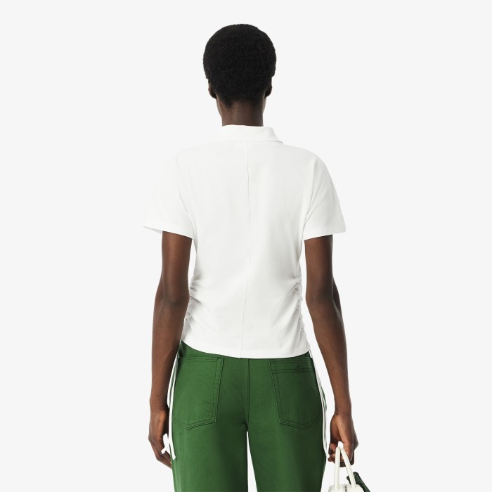 женское поло  из эластичного хлопка от бренда lacoste вид слева