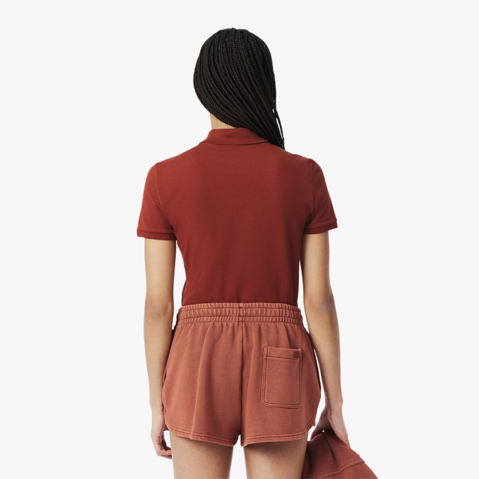 женское поло  приталенного кроя из эластичного хлопка от бренда lacoste вид слева