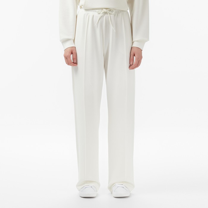 брюки sweatpants от бренда lacoste вид слева