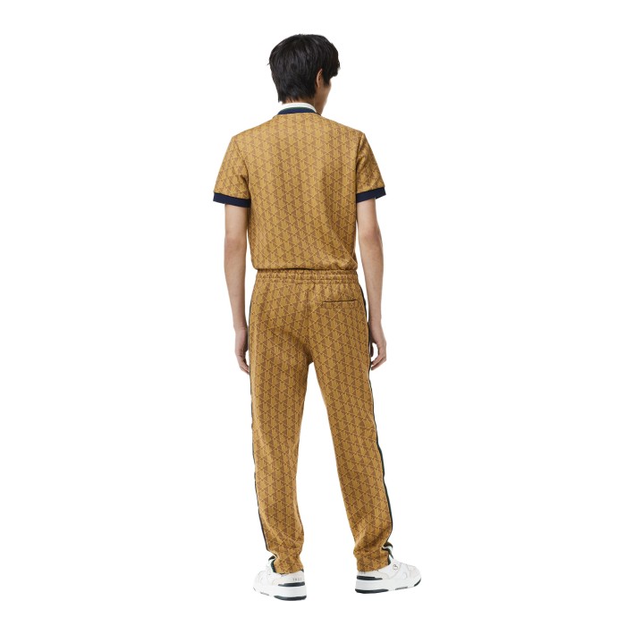 брюки tracksuit trousers от бренда lacoste вид слева