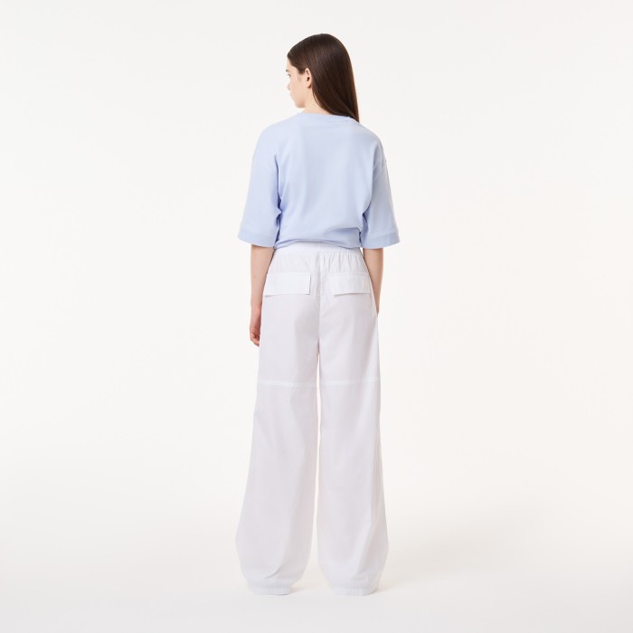 брюки trousers от бренда lacoste вид слева