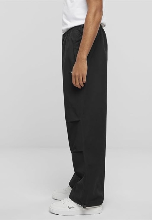 брюки woven retro washed parachute pants от бренда karl kani вид слева