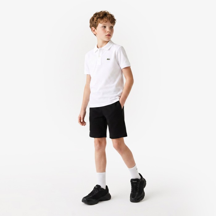 поло детское хлопковое поло lacoste от бренда lacoste вид слева