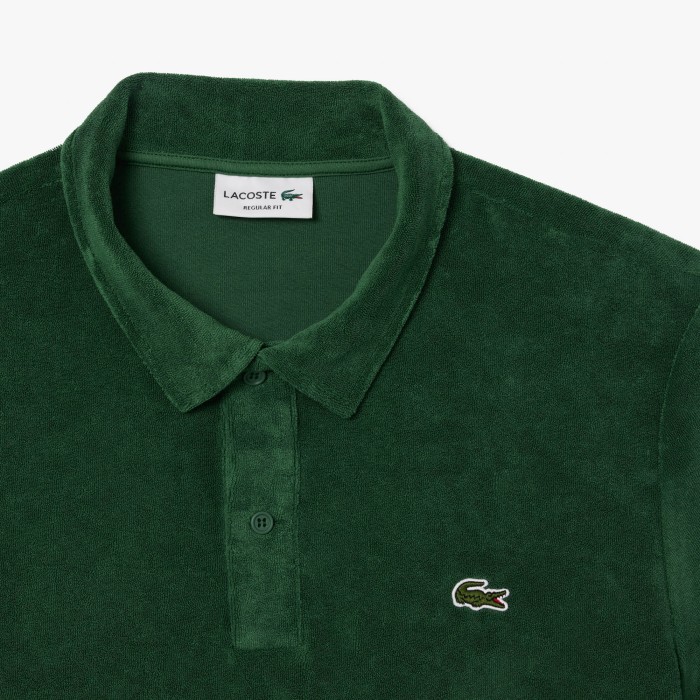 поло polo от бренда lacoste вид слева