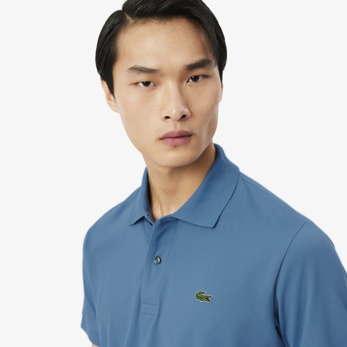 поло polo от бренда lacoste вид слева