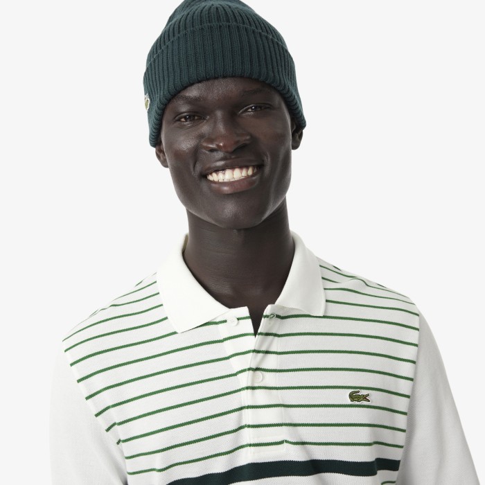 поло polo от бренда lacoste вид слева