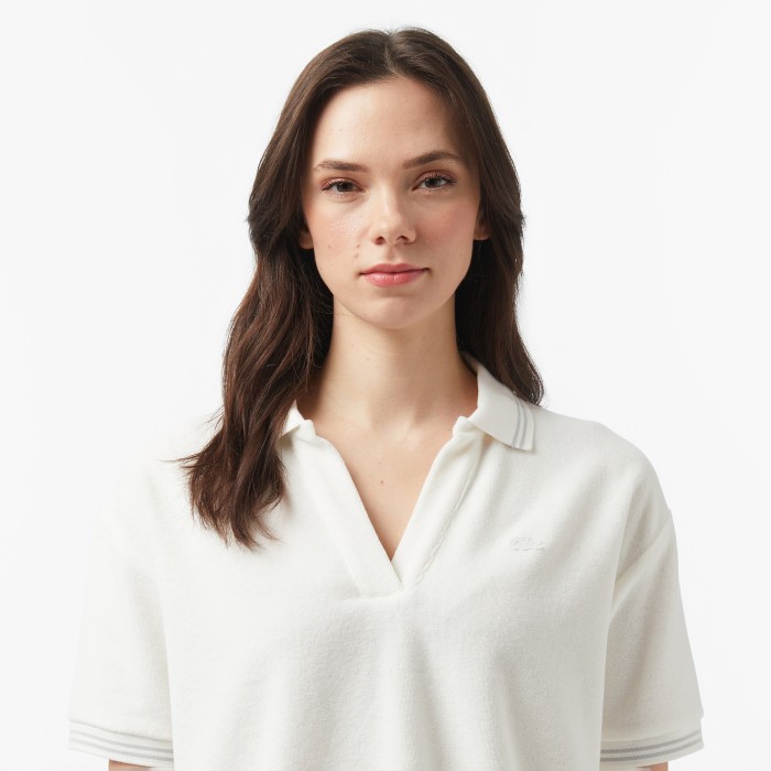 поло polo от бренда lacoste вид слева