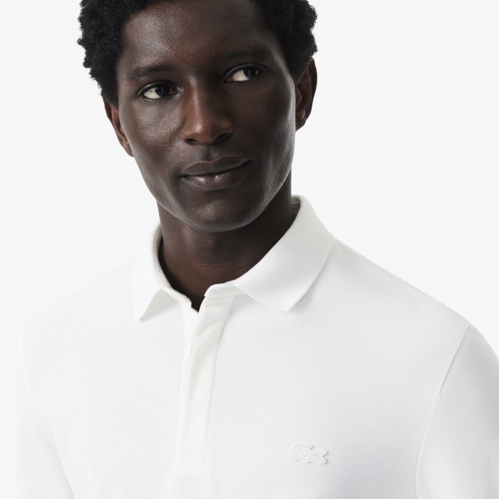 поло polo от бренда lacoste вид слева