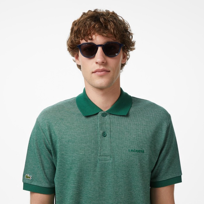 поло polo от бренда lacoste вид слева