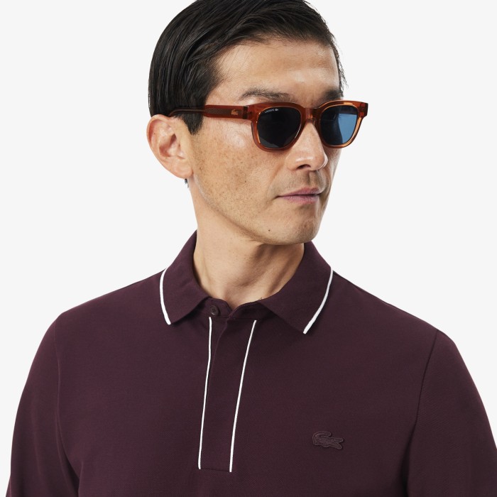 поло polo от бренда lacoste вид слева