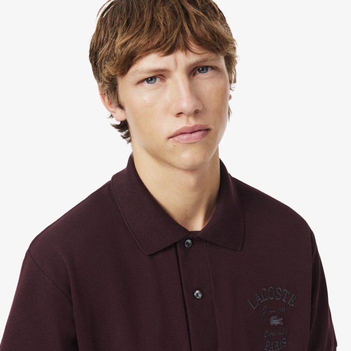 поло polo от бренда lacoste вид слева