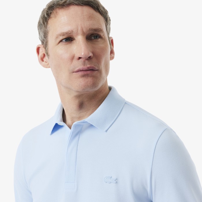 поло polo от бренда lacoste вид слева