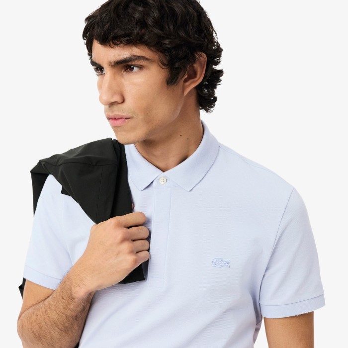 поло polo от бренда lacoste вид слева