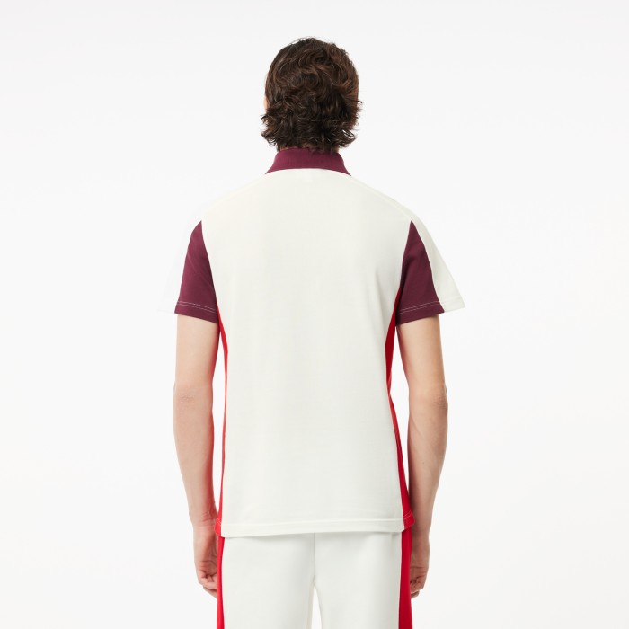 поло polo от бренда lacoste вид слева