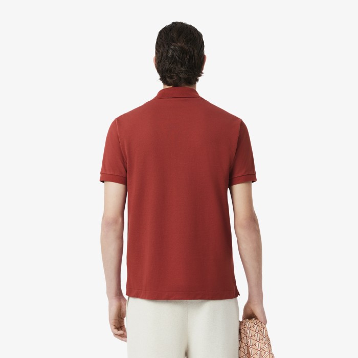 поло polo от бренда lacoste вид слева