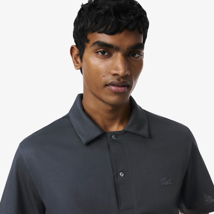 поло polo от бренда lacoste вид слева