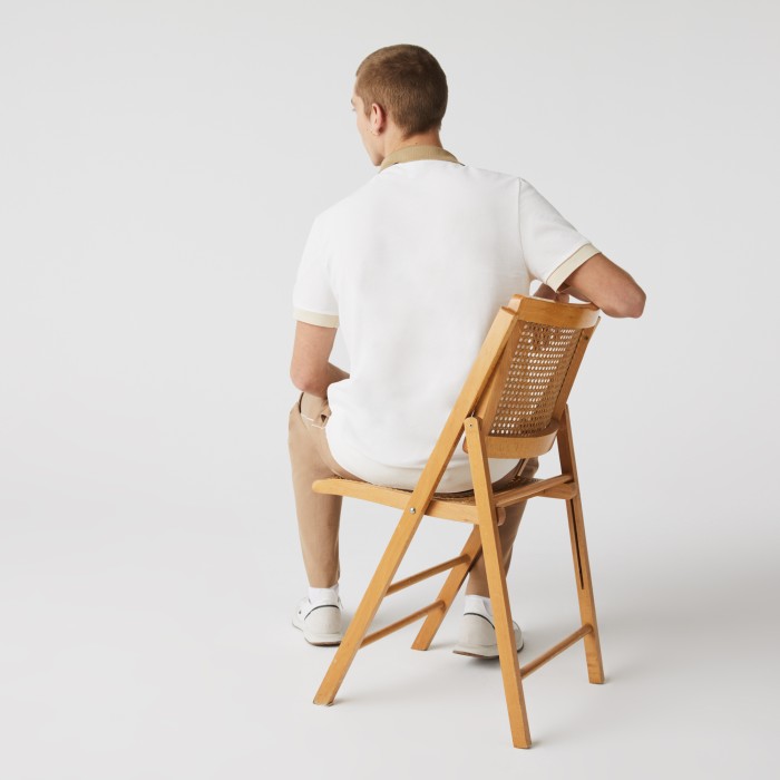 поло polo от бренда lacoste вид слева
