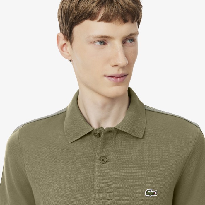 поло polo от бренда lacoste вид слева