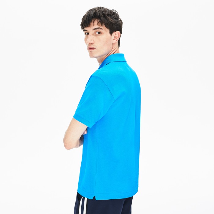 поло polo от бренда lacoste вид слева