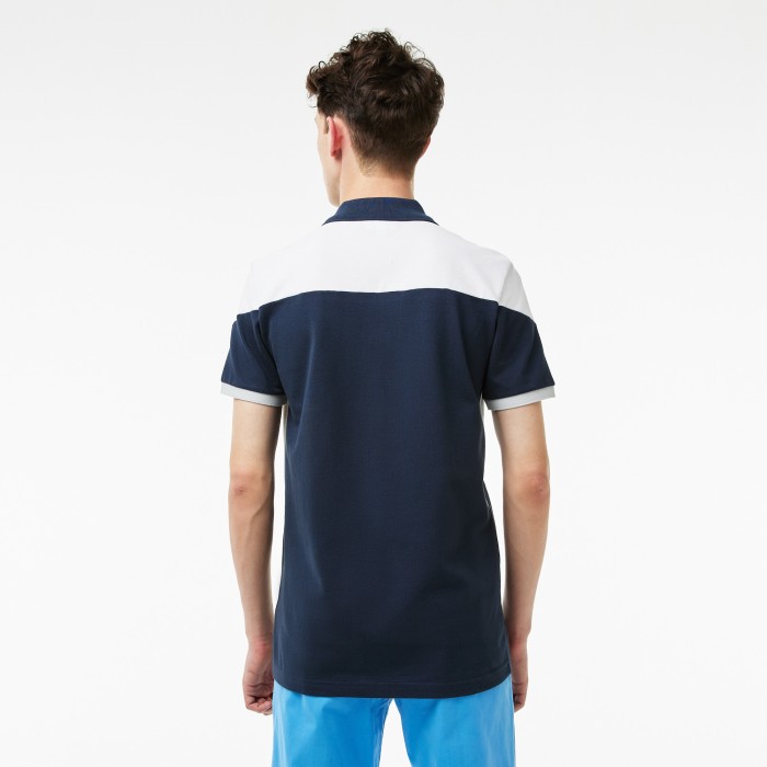 поло polo от бренда lacoste вид слева