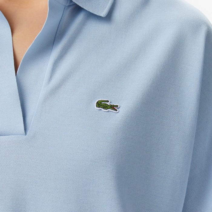 поло женская рубашка-поло lacoste из струящегося хлопка свободного кроя - качественный продукт вид сбоку