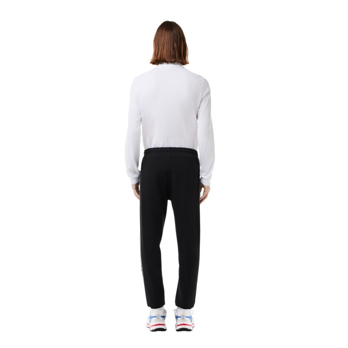 спортивные штаны sweatpants от бренда lacoste вид слева