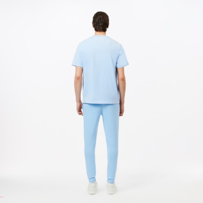 спортивные штаны tracksuit trousers от бренда lacoste вид слева