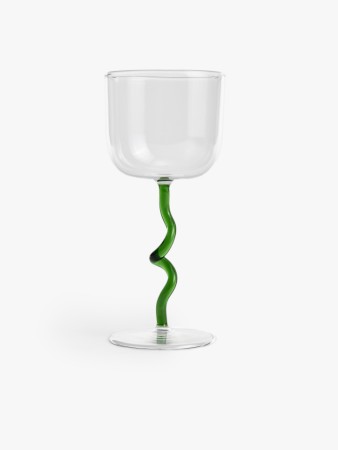 бокал из стекла с цветной ножкой фотография