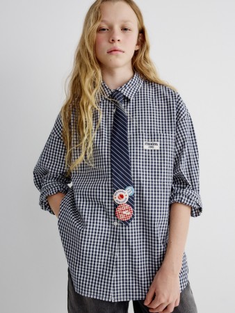 рубашка оверсайз в клетку для девочек фотография