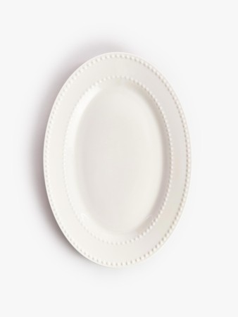 сервировочное блюдо из костяного фарфора фотография