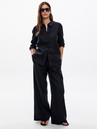 широкие брюки из 100% льна фотография