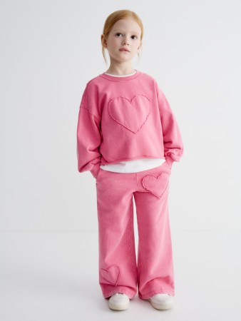 трикотажные брюки с аппликацией для девочек фотография