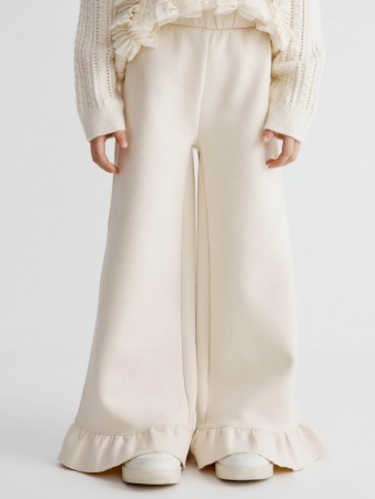 трикотажные брюки с оборками для девочек фотография