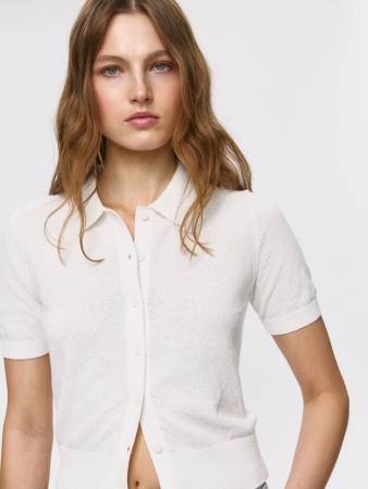 вязаный джемпер с коротким рукавом фотография