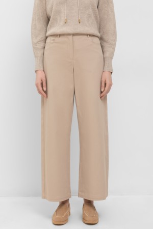 брюки  - женская одежда на клепках 