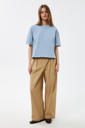 брюки с защипами фотография