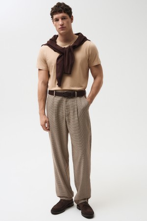 брюки в клетку фотография