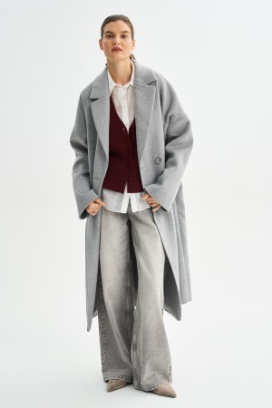 шерстяное пальто с поясом фотография