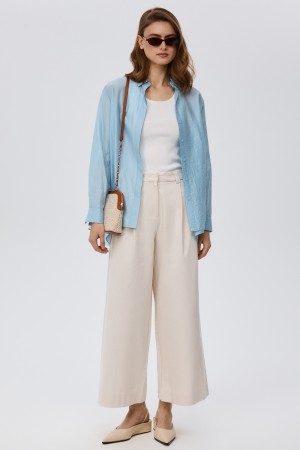 широкие брюки с защипами фотография