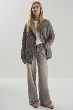 стеганая куртка с поясом фотография