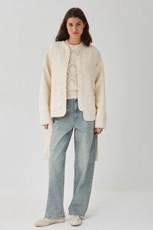 стеганая куртка с поясом фотография