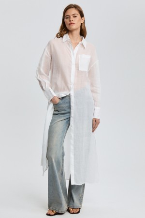 удлиненная блузка изо льна фотография